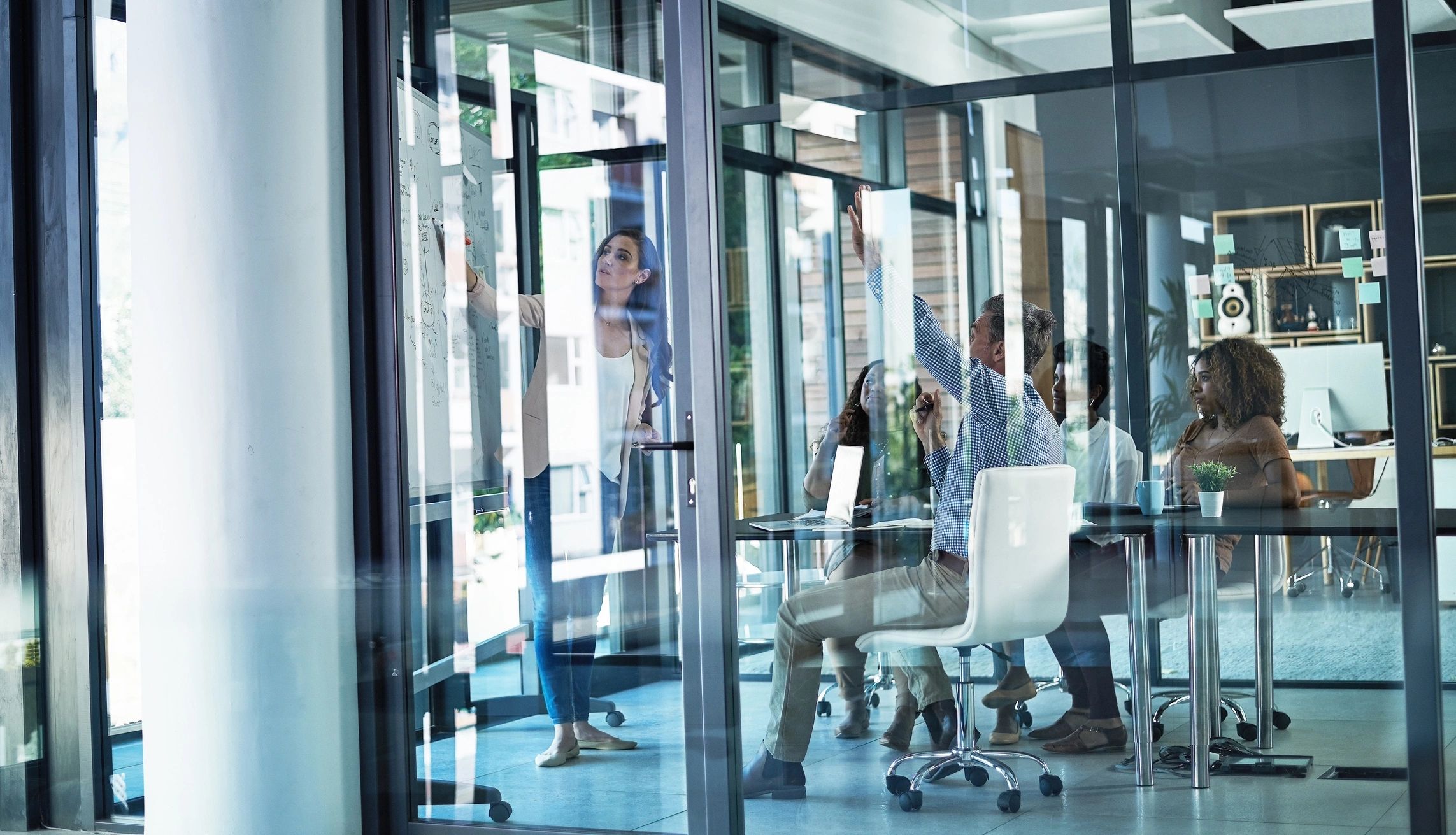 Business professionals listening during a strategy presentation